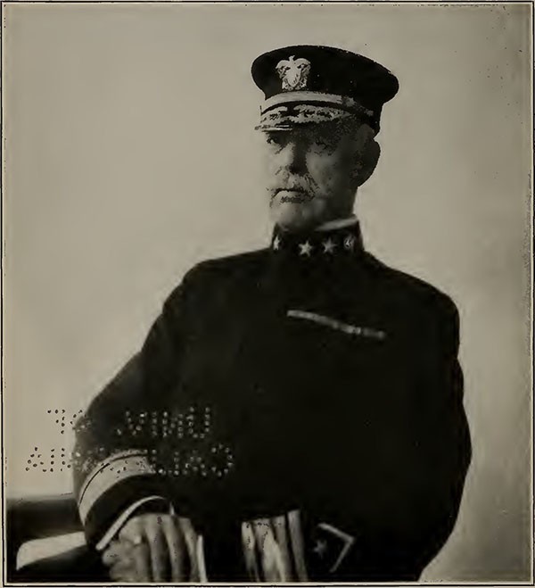 Image of Rear Admiral Charles P. Plunkett seated in uniform.