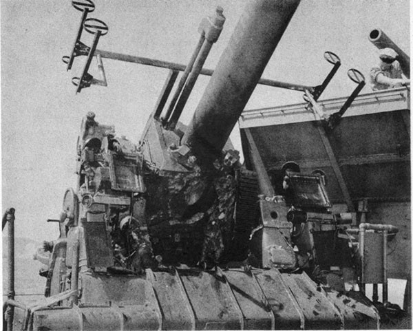 Hit #5. View of gun No. 4 showing deep gouge in slide at point of impact and shattered elevating arc casting.