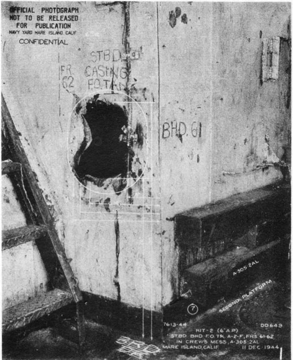 Hit #2. View looking aft at hole in forward starboard corner of A-2-F caused by 6-inch AP dud which passed through A-305-2AL. Shown looking aft on second platform.
