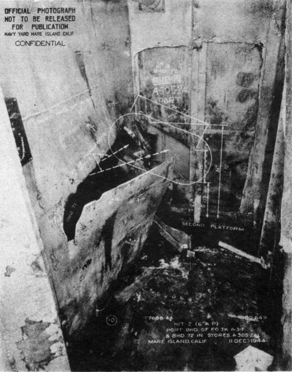 Hit #2. Hole in after port corner of A-3-F caused by 6-inch AP dud as it entered the forward fireroom. The projectile apparently broke into several large fragments before it emerged from A-3-F.