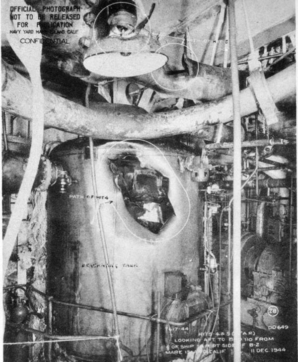 Hits 4 and 5. Looking aft and to port at deaerating tank and main steam line in forward engineroom.