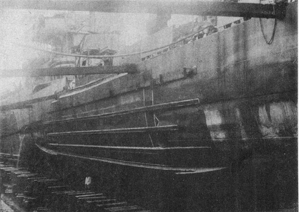 MAYRANT (DD402). Port shell amidships after temporary repairs at Malta. Note extent of repairs compared with extent of buckling shown in Photo 7-1.