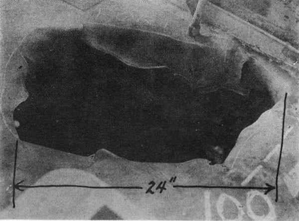 SHUBRICK (DD639). Hole in main deck at frame 101 made by bomb which was 13-1/2 inches in diameter.