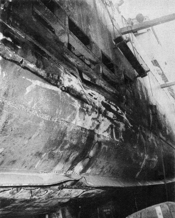 HUGH W. HADLEY (DD774). Starboard side looking forward from frame 115 in dock at Kerama Retto. Partial structural repairs have been completed in way of the hole made by the second Kamikaze.