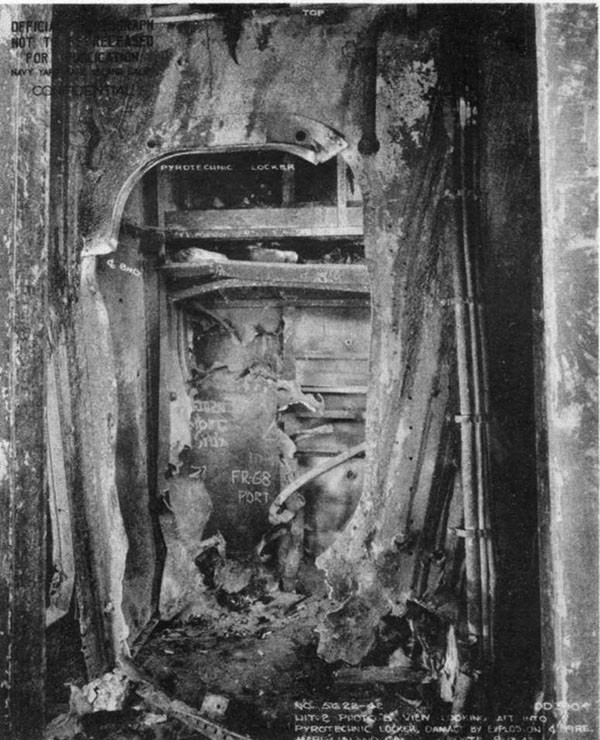 Hit #2. Inside of chart-house looking aft into quartermaster storeroom and pyrotechnic locker, showing temporary patch in place.