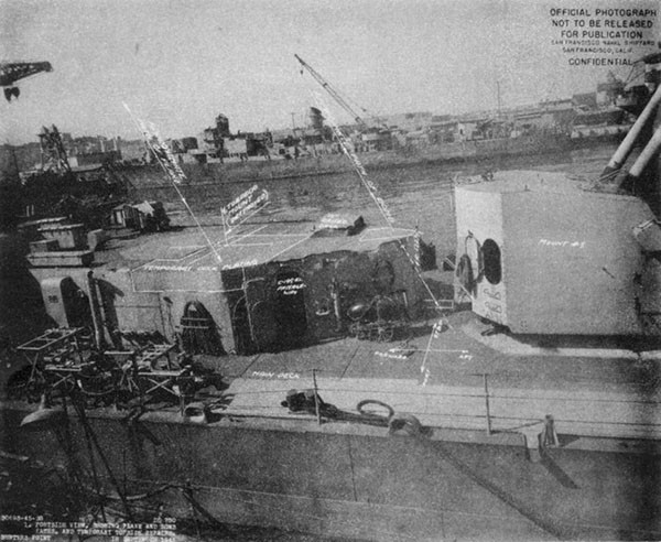 STORMES (DD780). Port side aft showing plane and bomb paths and temporary topside repairs.