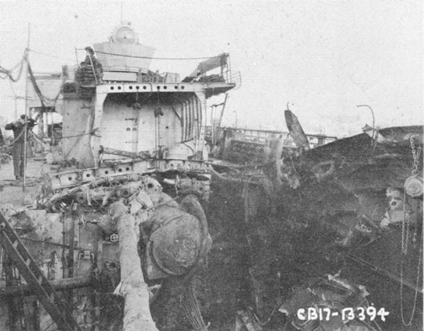 Photo 9: 9 February 1943 - View of damage aft looking from main deck aft.
