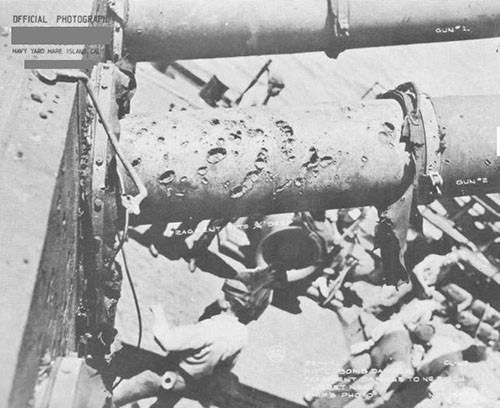 Photo 18: Bomb damage, No. 2 gun of No. 4 turret.