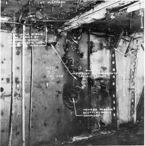 Photo 14: Fragment damage to bulkhead 35 viewed from magazine A-507-M.