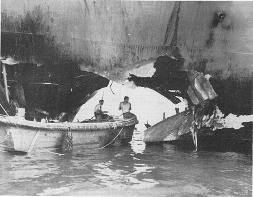 Photo 17: Torpedo damage to port shell U.S.S. ALHENA upon arrival in port.