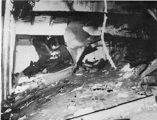 Photo 20: Blast and fragment damage to second deck, looking from port to starboard at frame 166.