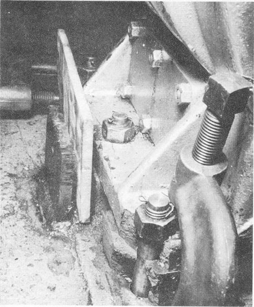 Photo I-7: First near-miss. Compression failures in foot of bearing housing, starboard side No. 1 steady bearing, No. 3 shaft.