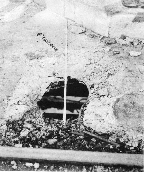 Photo No. 2: Hole In 6-inch reinforced concrete pier, measuring 17" x 15".