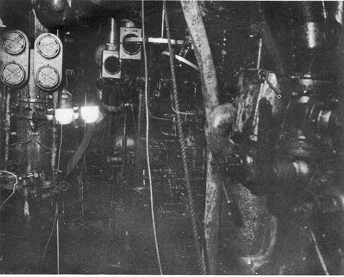 Photo 11: After engineroom lower level. Note machinery covered with oil and that gage glasses taped with "scotch tape" were unbroken.