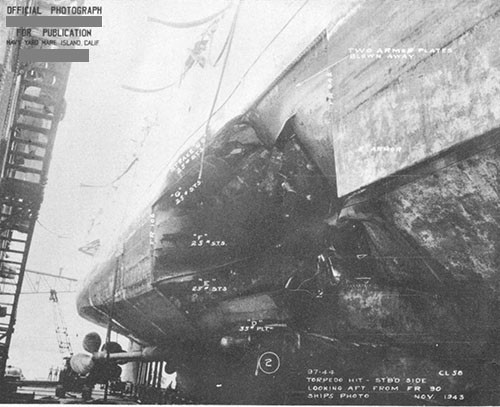 Photo 17: Armor belt. Damage to starboard shell, looking aft.