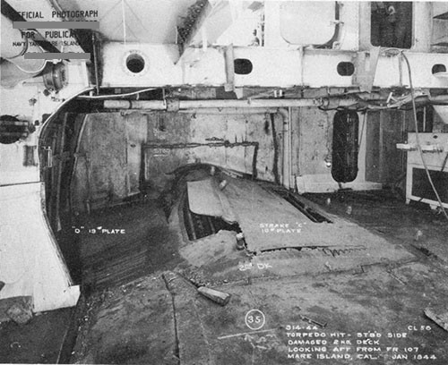 Photo 29: Compartment B-204-L showing ruptured second deck.
