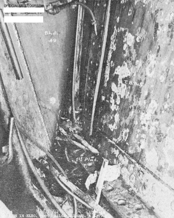 Photo 16. Note opening between torpedo protection bulkhead No. 5 and the first platform deck, and between that bulkhead and stiffener at frame 47.
