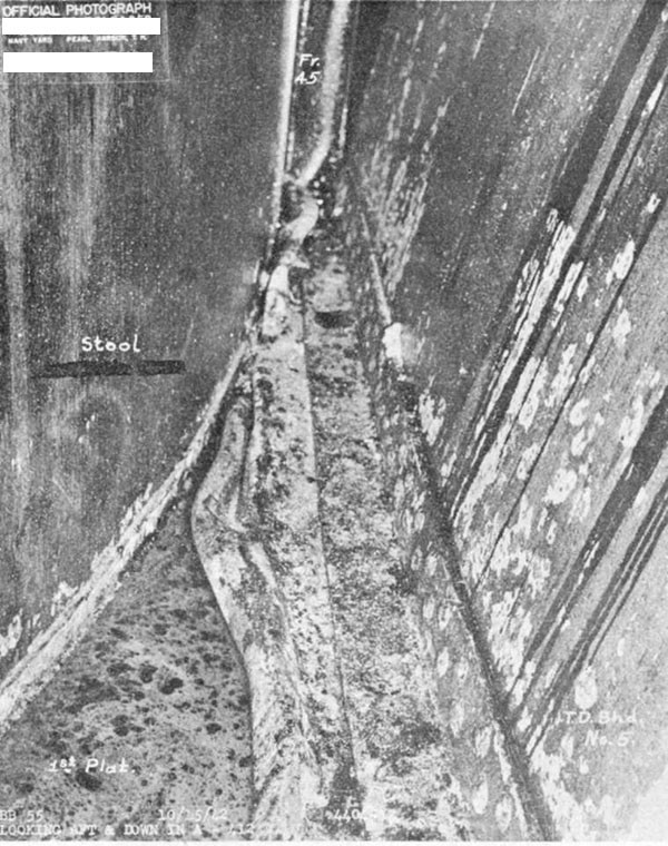 Photo 22. First platform deck crumpled by impact of torpedo bulkhead No. 5 in A-412V, looking aft.