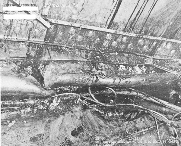Photo 27. One of four angles in the connection between torpedo protection bulkhead No. 5 and first platform deck torn.