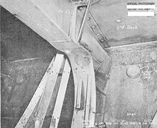 Photo 34. Buckled bracket of beam under second deck at frame 51.