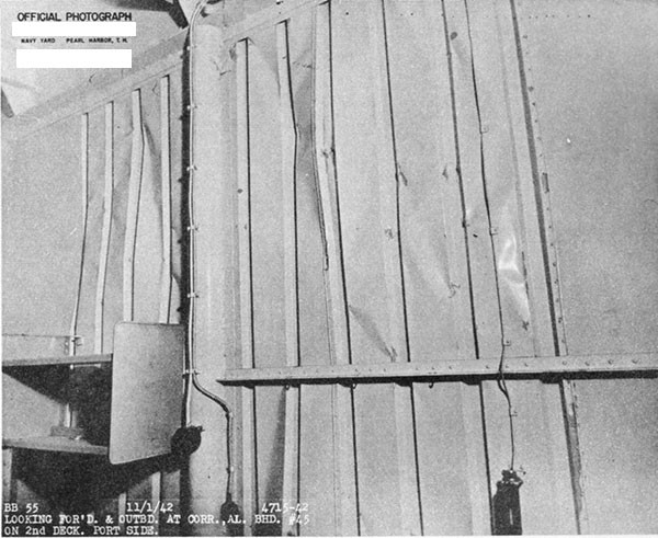 Photo 35. Wrinkled metal joiner bulkhead in officer's stateroom on second deck, port.