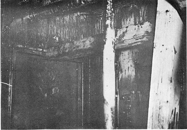 Photo 52. Shoring of cofferdam around doorway into passage A-316T from A-310-1L, looking aft and to port. Black area in door frame is a rubber gasket on the cofferdam.