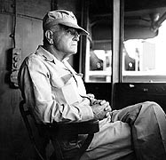 Admiral William F. Halsey, USN, Commander, Third Fleet On the bridge of his flagship, USS New Jersey (BB-62), while en route to carry out raids on the Philippines, December 1944.