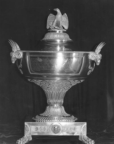Silver urn presented to Captain Isaac Hull, USN, By the citizens of Philadelphia, Pennsylvania, in recognition of his 19 August 1812 victory over HMS Guerriere while in command of USS Constitution. The urn was made by Philadelphia silversmiths Thomas Fletcher and Sidney Gardiner, and engraved by W. Hooker. This view shows the urn's obverse side, with presentation inscription. The urn was loaned to the Navy in 1911 by Dr. Isaac Hull Platt. In 1982 it was transferred to the USS Constitution Museum, Boston, Massachusetts. Photographed 3 September 1964 by B.L. Mason. U.S. Naval Historical Center Photograph. Photo #: NH 48964 .