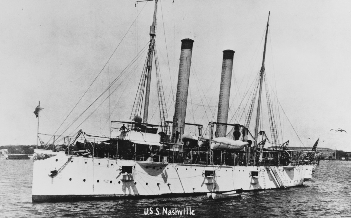 A picture of the USS Nashville in port.