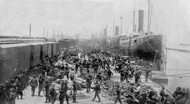 A photograph of troops working on the docks at Port Tampa, Florida.