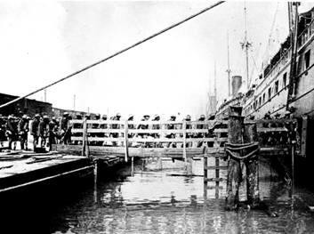 A photograph of the Rough Riders boarding the transport Yucatan.