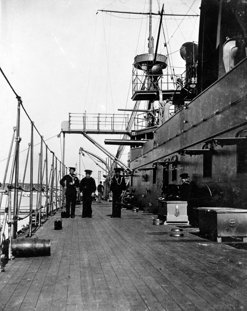 A photo of sailors on the port deck side of the U.S.S. Maine.