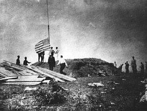 A picture of some U.S. Marines raising the American flag at Guantanamo.