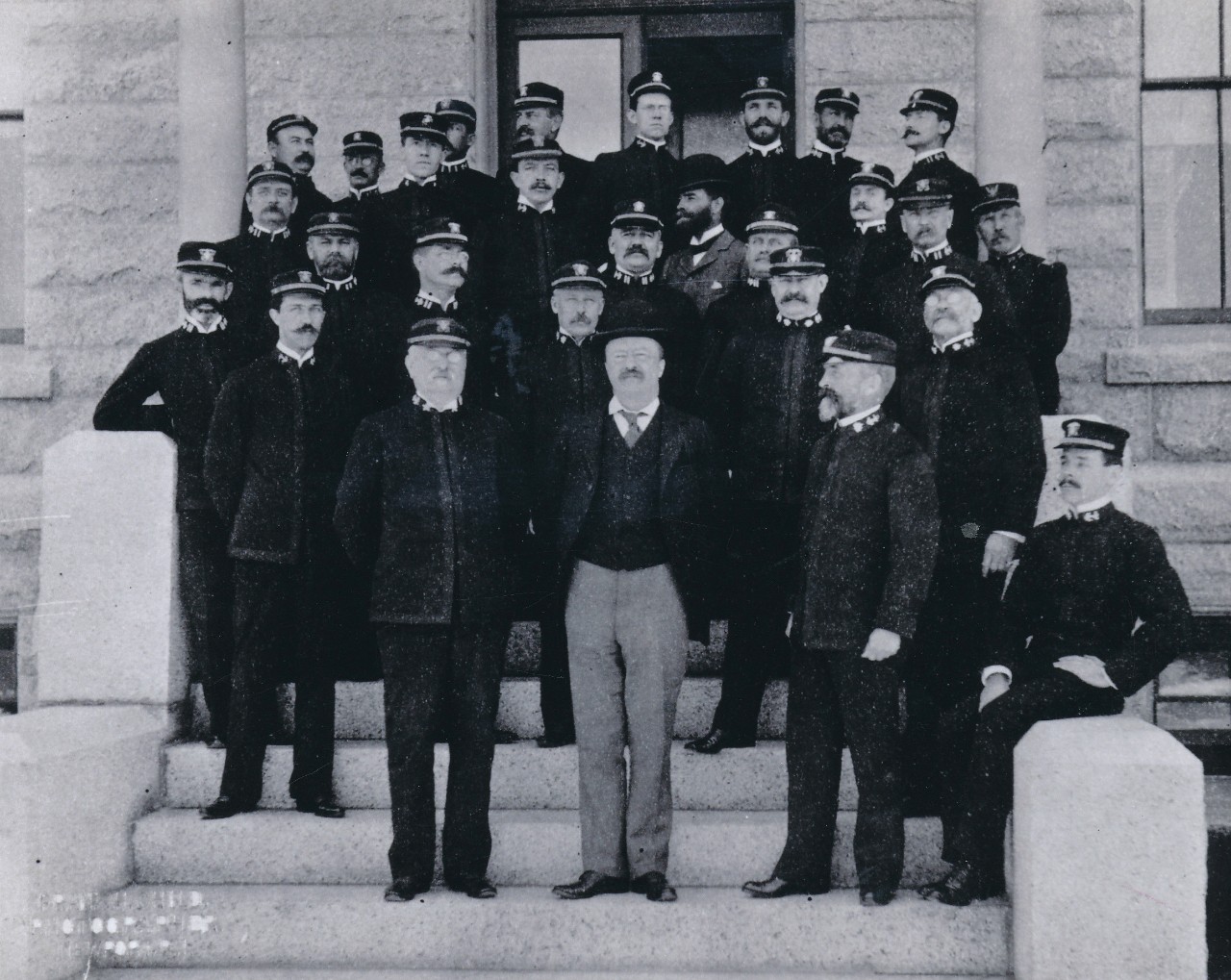 A group portrait including Asst. Secretary of the Navy Theodore Roosevelt who gave the opening address at the Naval War College in 1897.