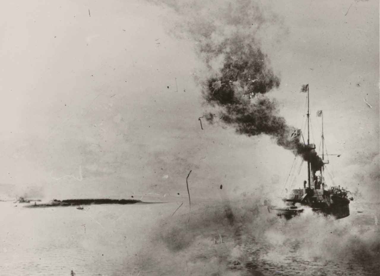 A picture of a battleship firing guns during the Battle of Santiago.