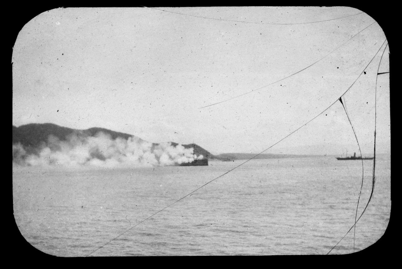 A photograph of a Spanish ship in flames.