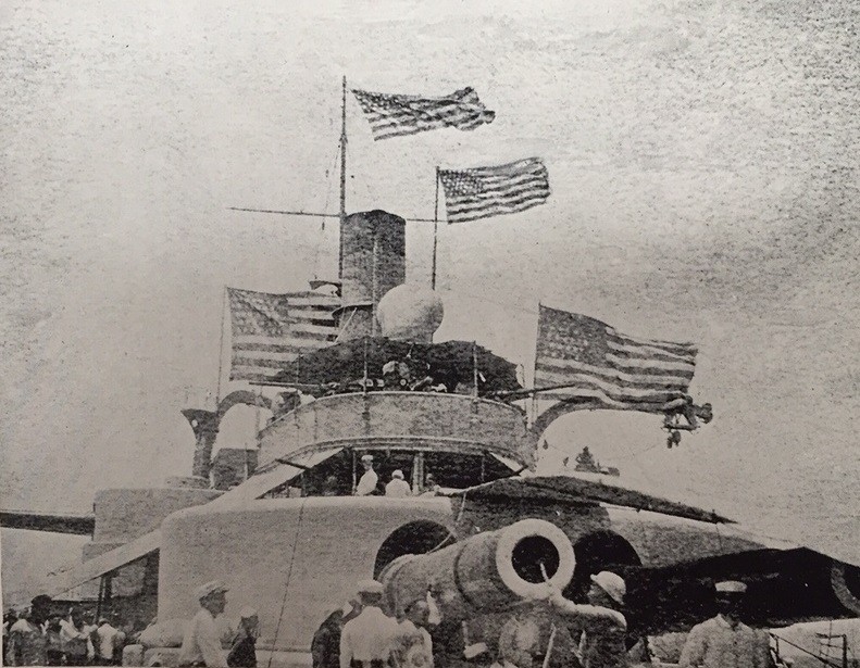 A picture of American flags on the USS Indiana.