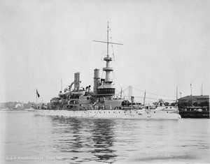 A photograph of the USS Massachusetts in port.