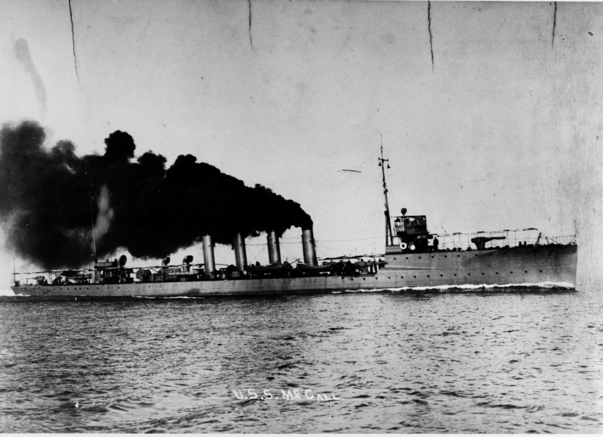 Photograph of the destroyer with smoke billowing from smokestacks