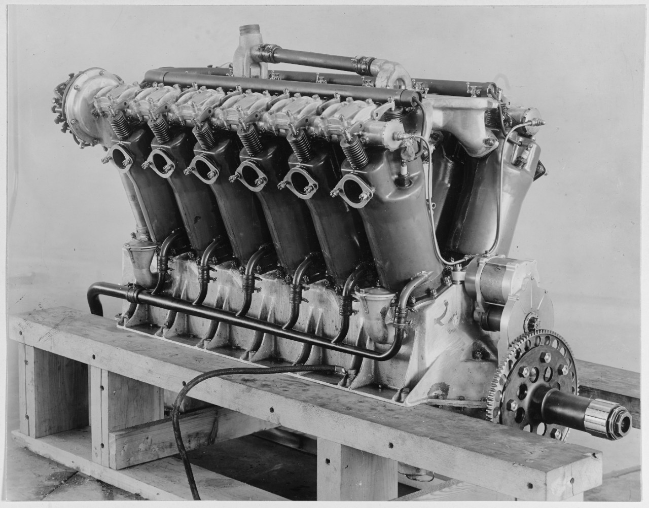 Photograph of an engine on wooden blocks
