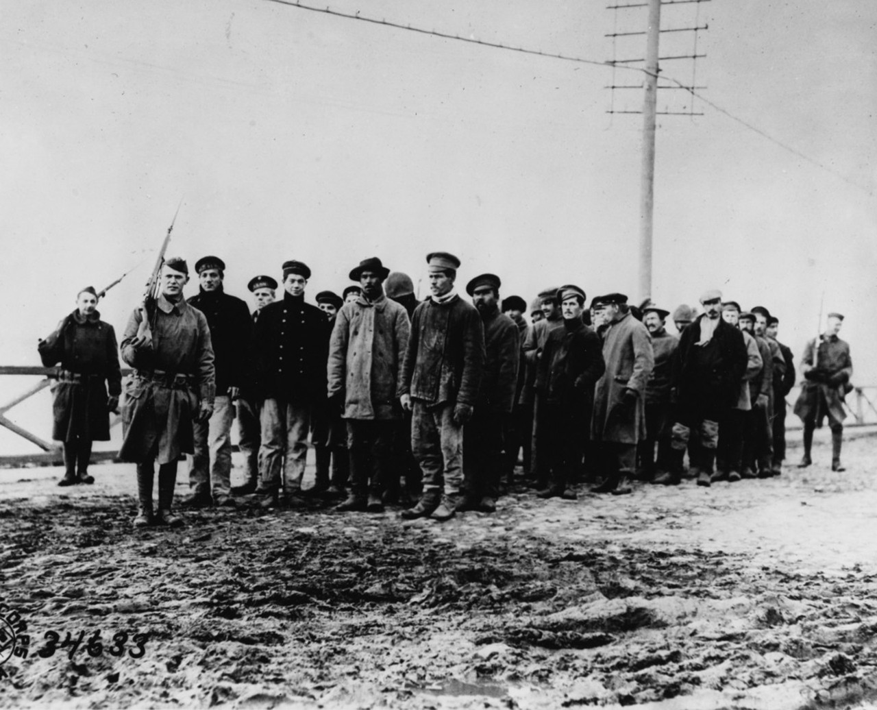 <p>U.S. Army troops guard Bolshevik prisoners of war, Archangel, 16 October 1918. Image 111-SC-34633, courtesy of the National Archives.</p>
