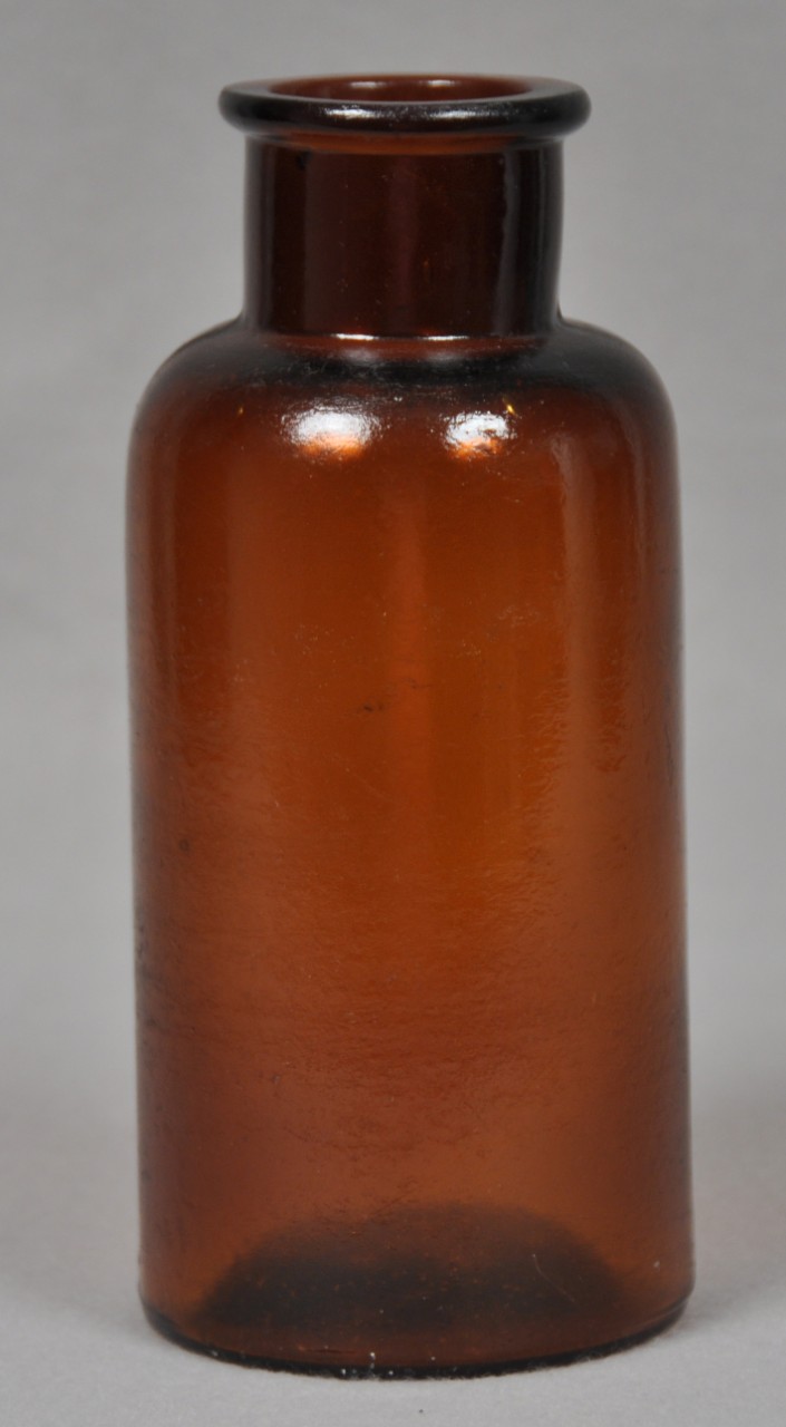 <p>An undecorated non-screw top brown bottle.</p>