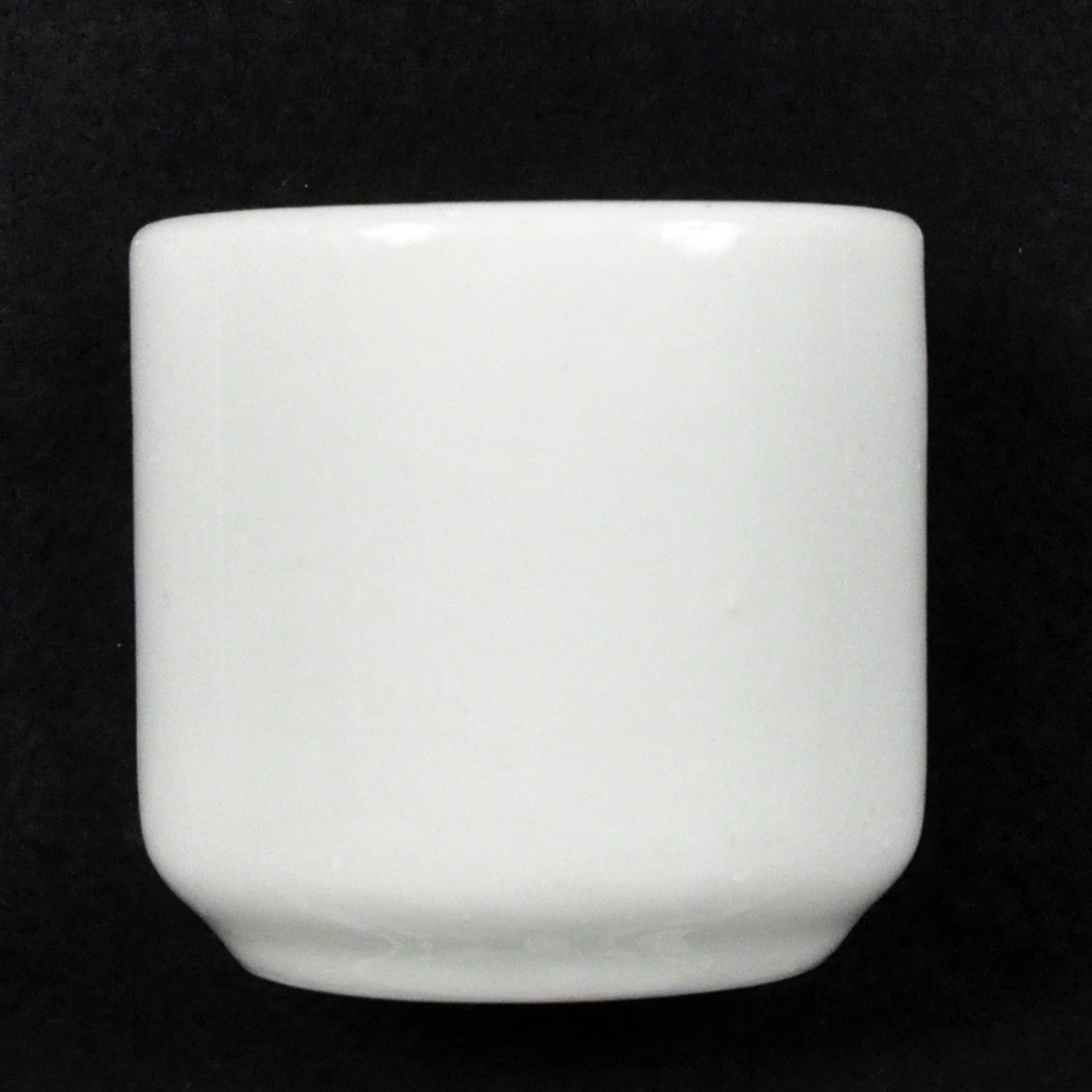 <p>A undecorated white porcelain cup from the USS <i>Houston</i>.</p>