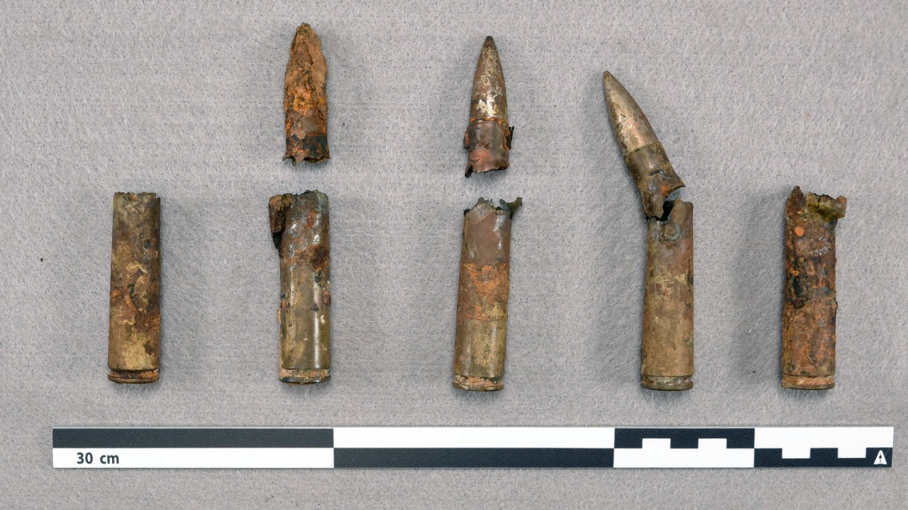 <p>Five untreated incomplete 0.50 caliber bullets with red and orange rust covering all surfaces.</p>