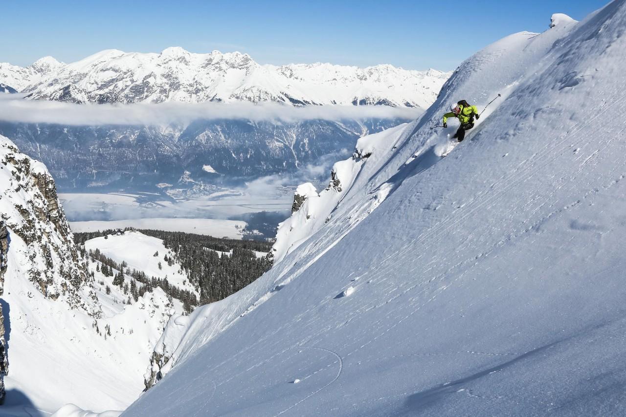 Steep skiing above valley